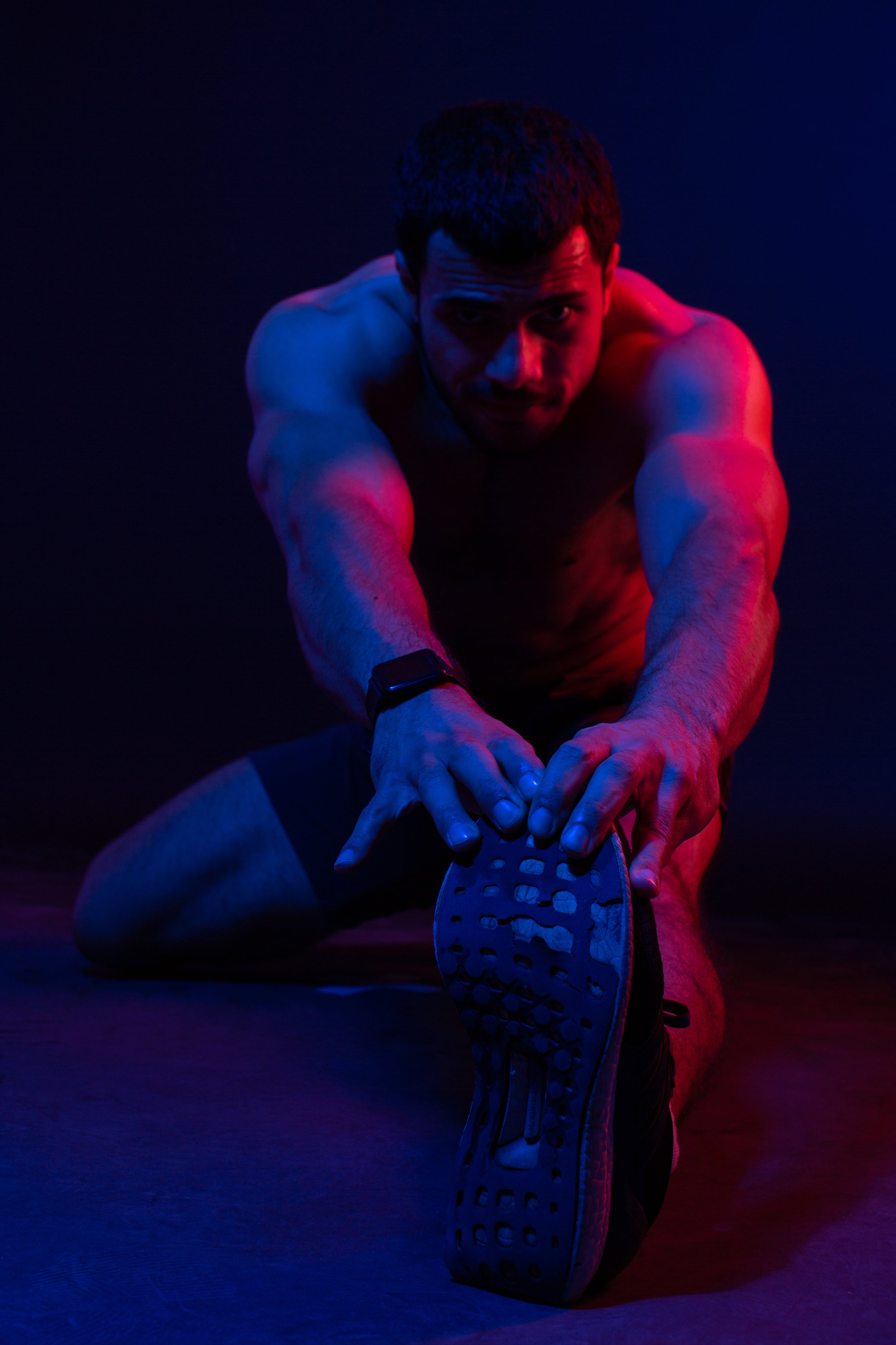 man-doing-warm-up-dark-room.jpg